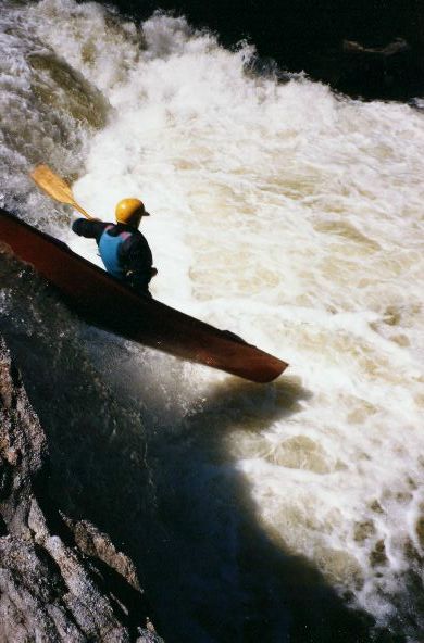 John Reynolds touches down while paddling glass over Grotto falls.
