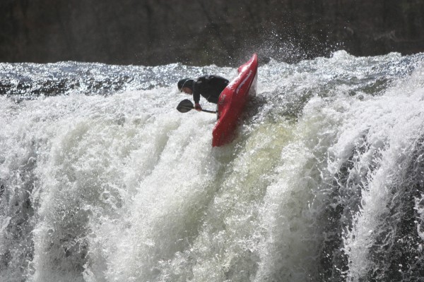 Jeremy Adkins demonstrating the principle that there are multiple ways to run a waterfall. Hucking it at the inaugural 2005 North Alabama Whitewater Festival. Photo by David Haynes